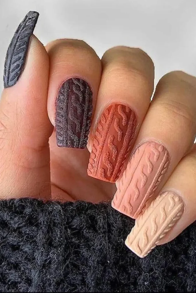 Long matte nails with raised cable knit sweater texture design.
