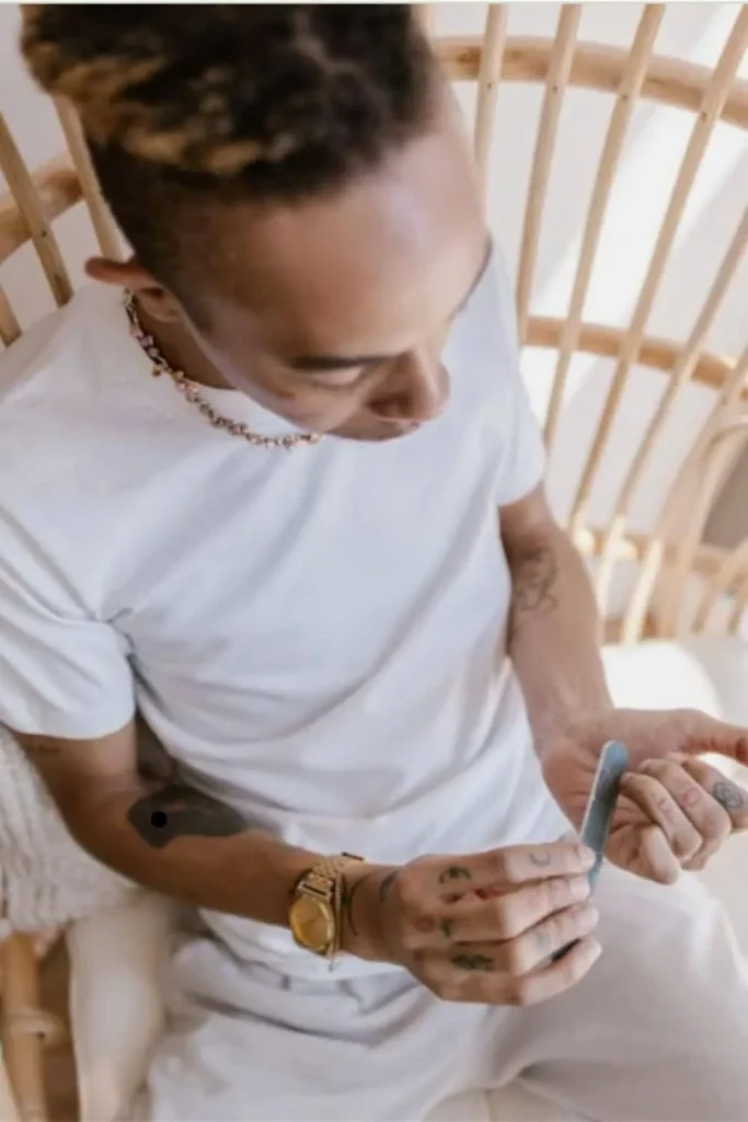 Gentle Cuticle Care Guide featuring a man filing his nails to maintain a clean and tidy matte finish.